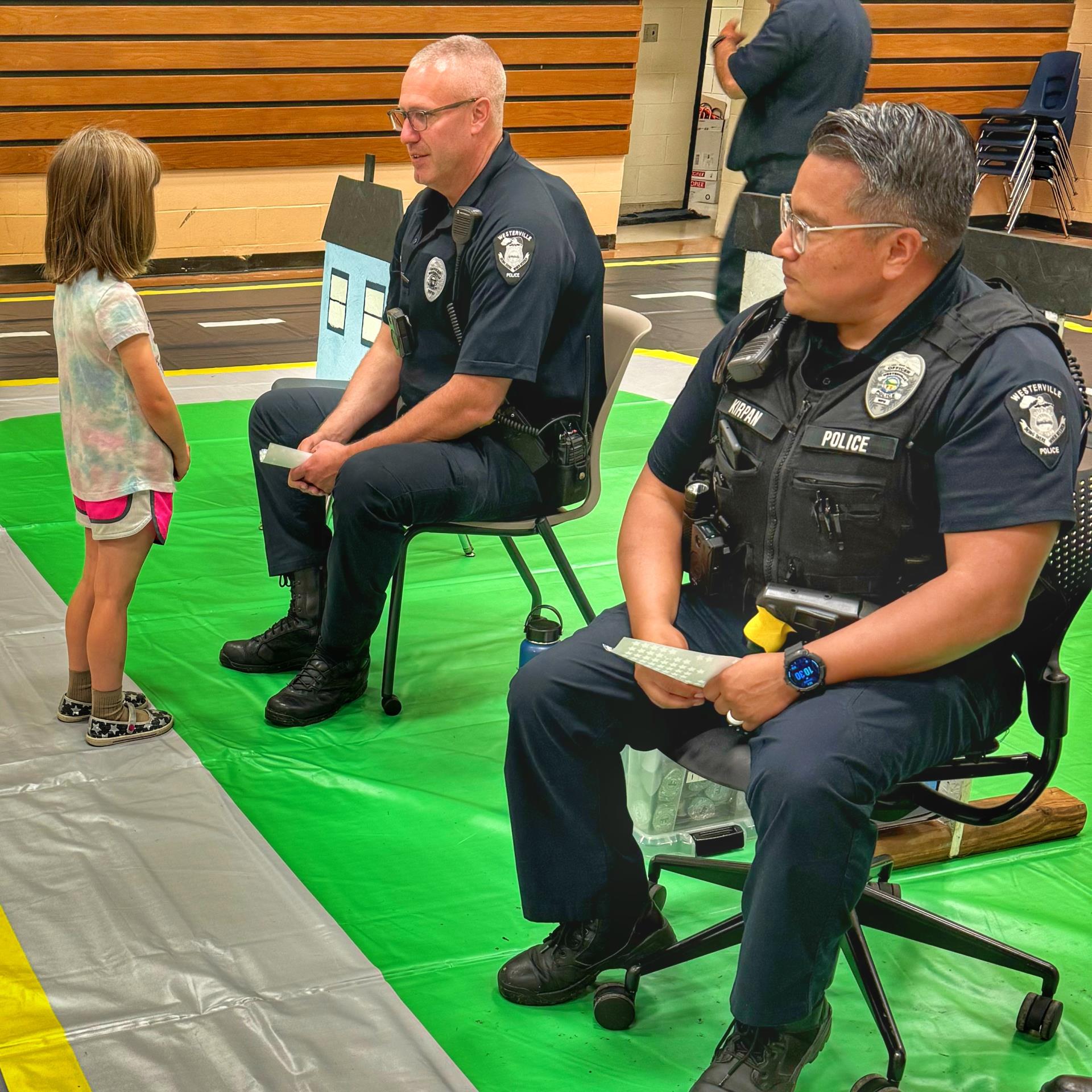 Officers talking to child